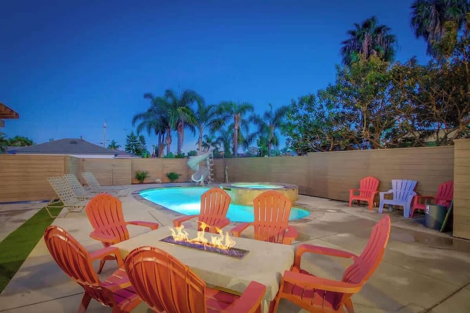 Gather around the fire pit for cozy conversations and good times, just steps away from the pool. The perfect spot to relax and unwind!
