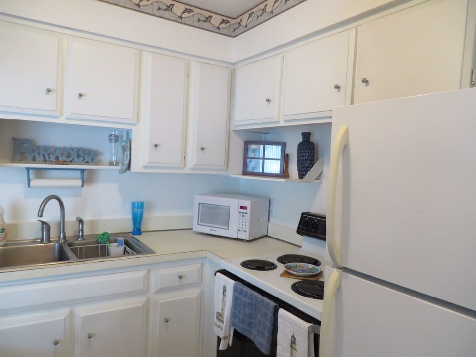 Open concept kitchen with breakfast bar.