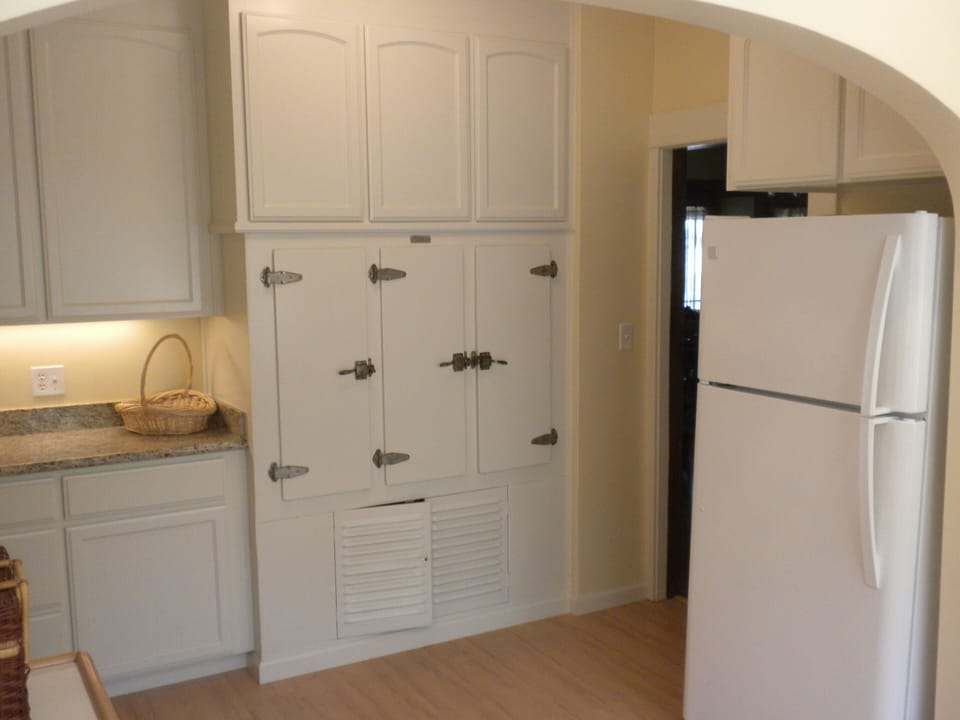 New refrigerator and the 1926 Frigidaire ice box .for wine storage.