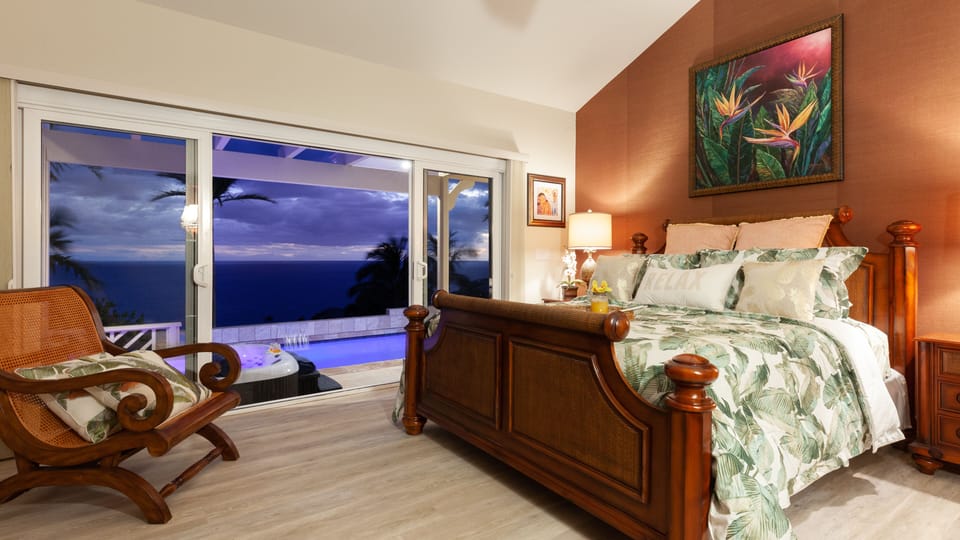 The large master bedroom has direct access to the hot tub and pool! 