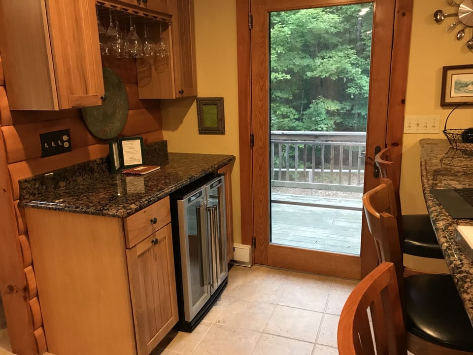 Wine and liquor bar close to kitchen and dining