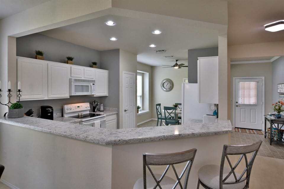 Breakfast Bar for Extra Seating or Serving Bar! Easy-care Quartz Counters!
