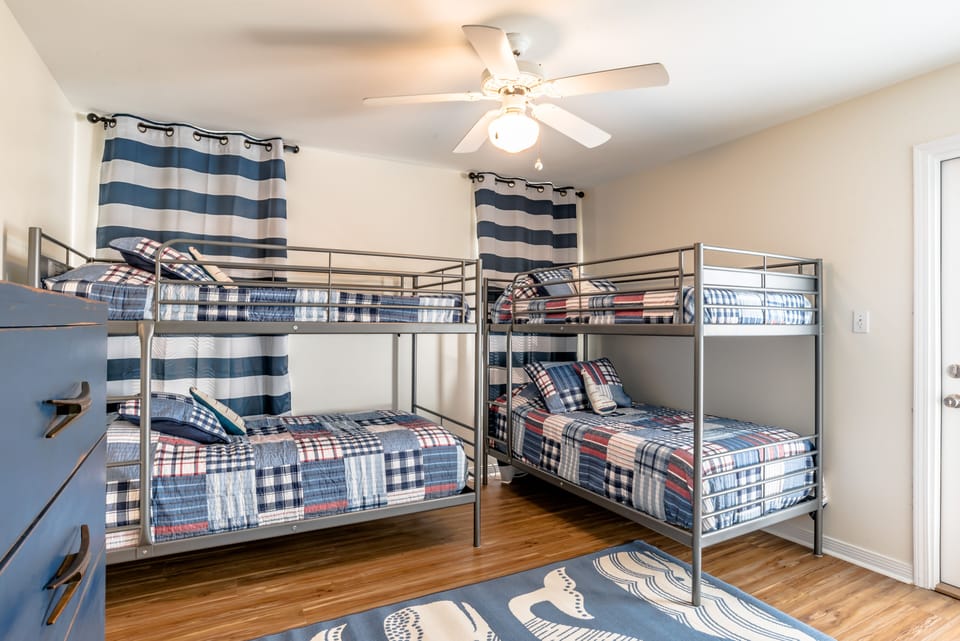 4 twin bunk bed room. The room has a 32 inch flatscreen and an ensuite bathroom.