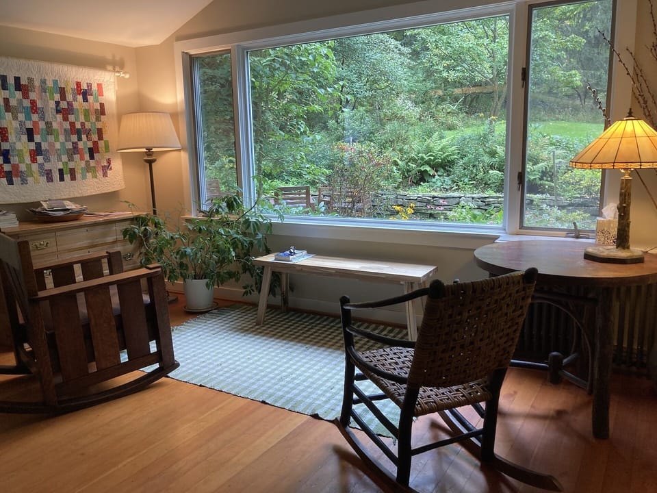 Enjoy watching the birds from the sitting area in the garden room.