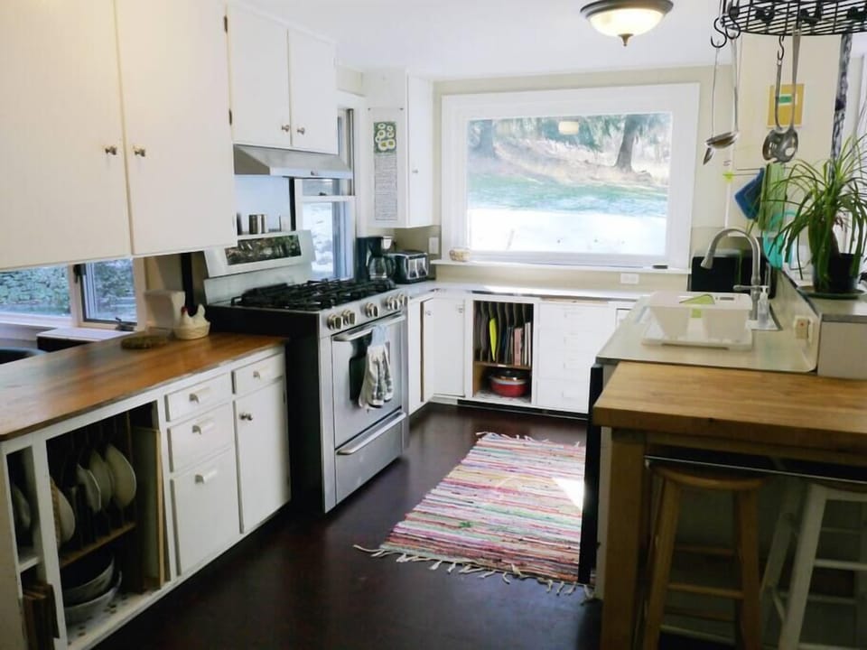 The large efficient period kitchen provides all you need for meal prep.