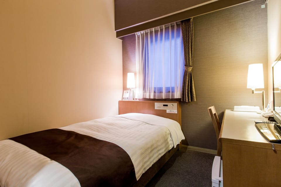 Down comforters, desk, blackout drapes, iron/ironing board