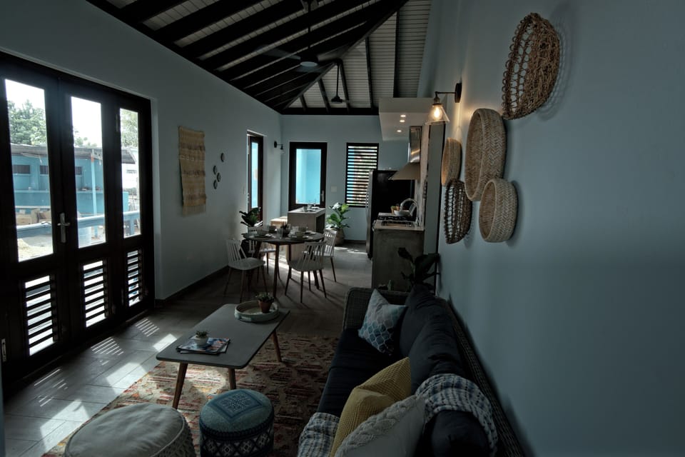High ceilings make it easy to enjoy the comfortable breezes off of the beach .