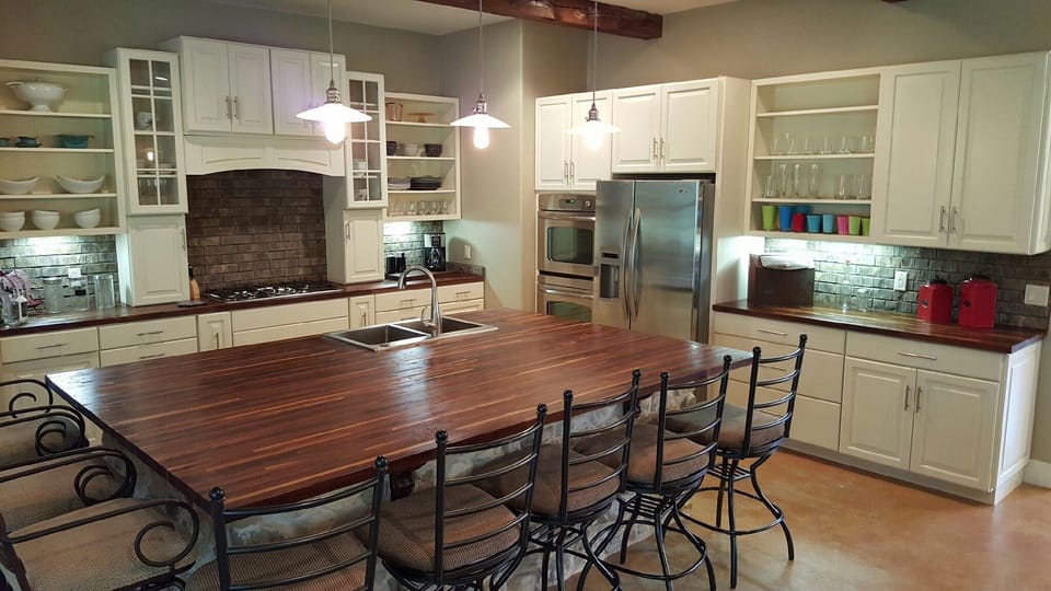 Beautiful mahogany countertops and an island that seats 8.