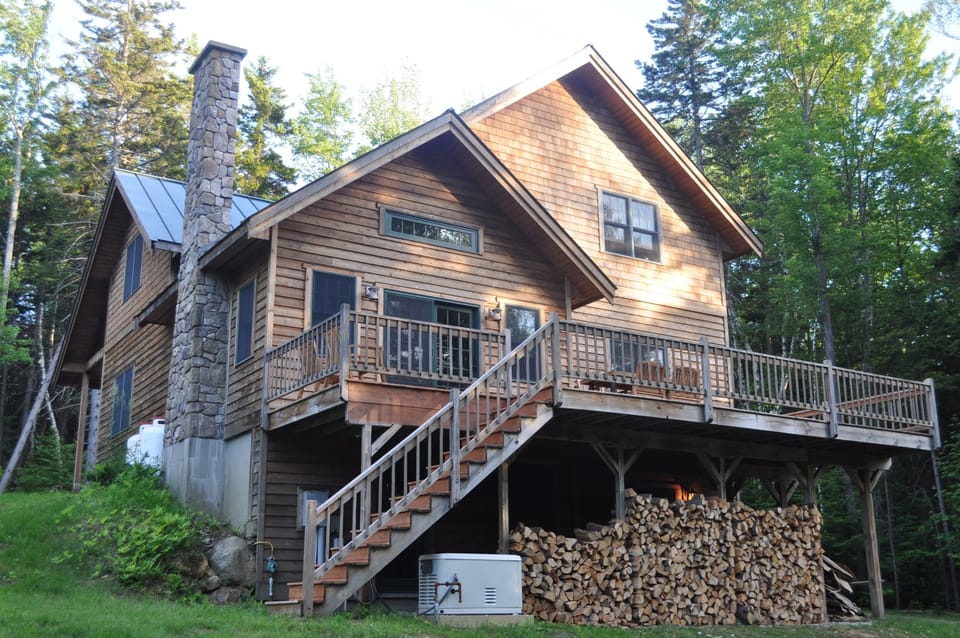 The back of the home in the summer.