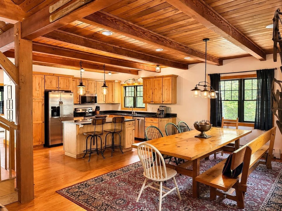 Dining room with antique table for 12, directly off the kitchen and family room.