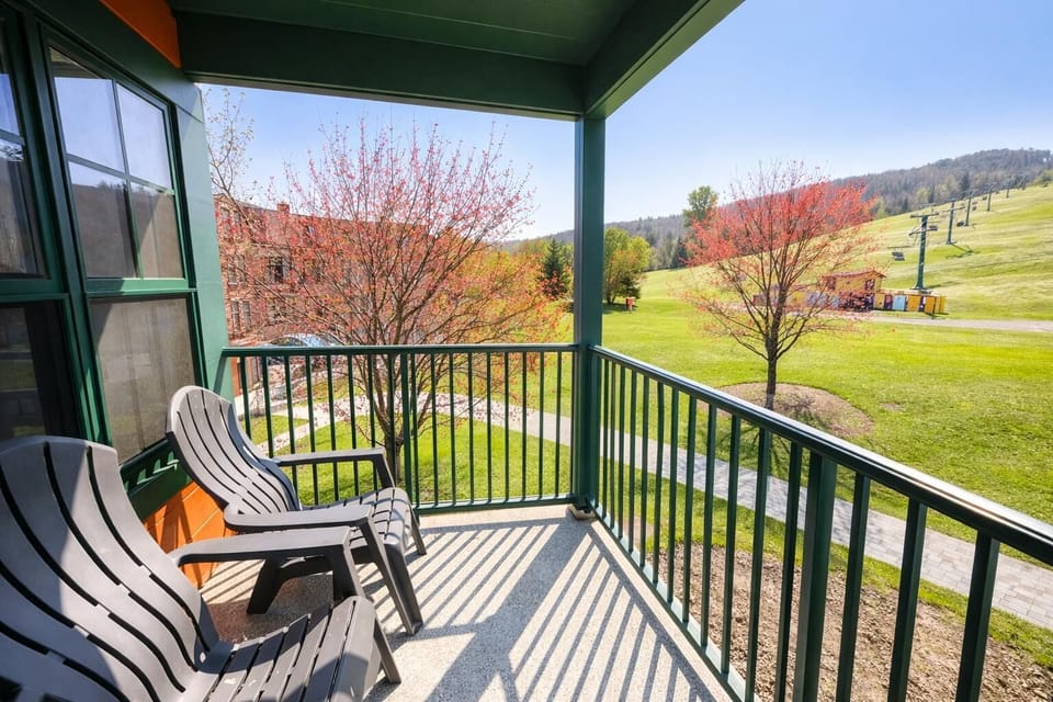 Cozy balcony retreat with scenic countryside views