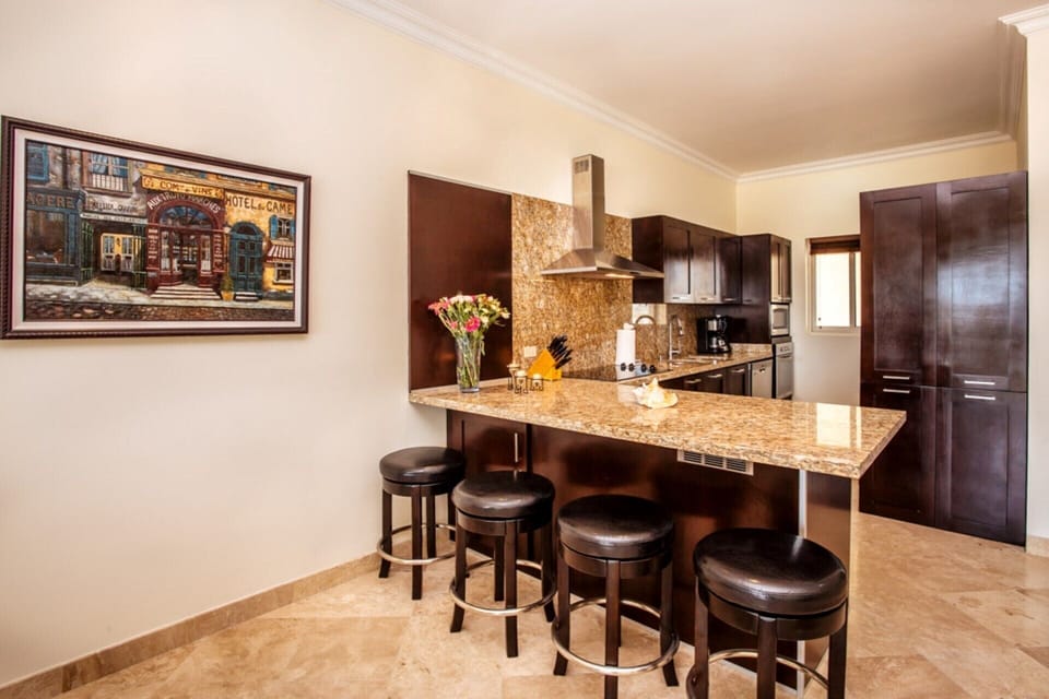 Visit with guests as you prepare meals in your gourmet kitchen. BBQ on balcony 