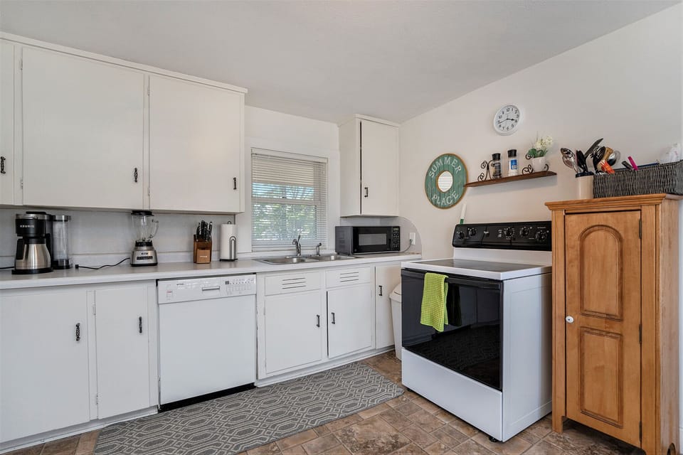 The kitchen is fully stocked with all cookware and utensils.