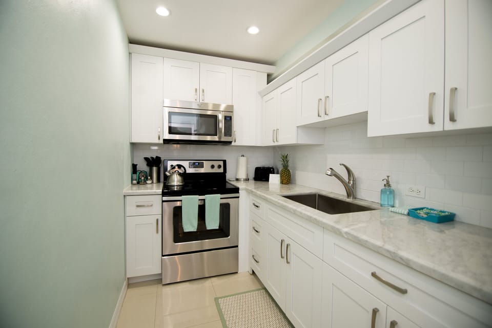 Fully equipped kitchen with stainless steel appliances.
