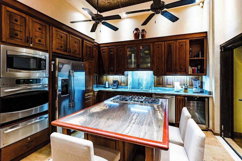 Bright and spacious kitchen with full amenities, ideal for families or groups enjoying a Tamarindo vacation rental experience.