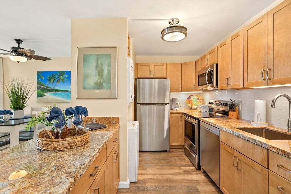 A modern kitchen with granite counters and stainless appliances, where island flavors come to life.