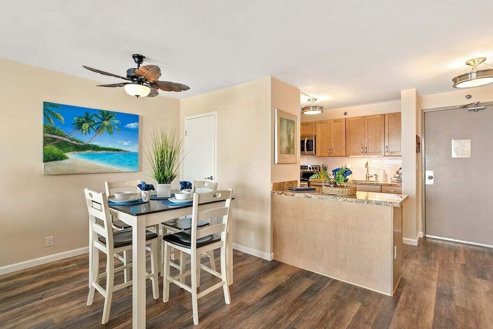 A dining and kitchen space with modern finishes, blending coastal charm with everyday convenience.
