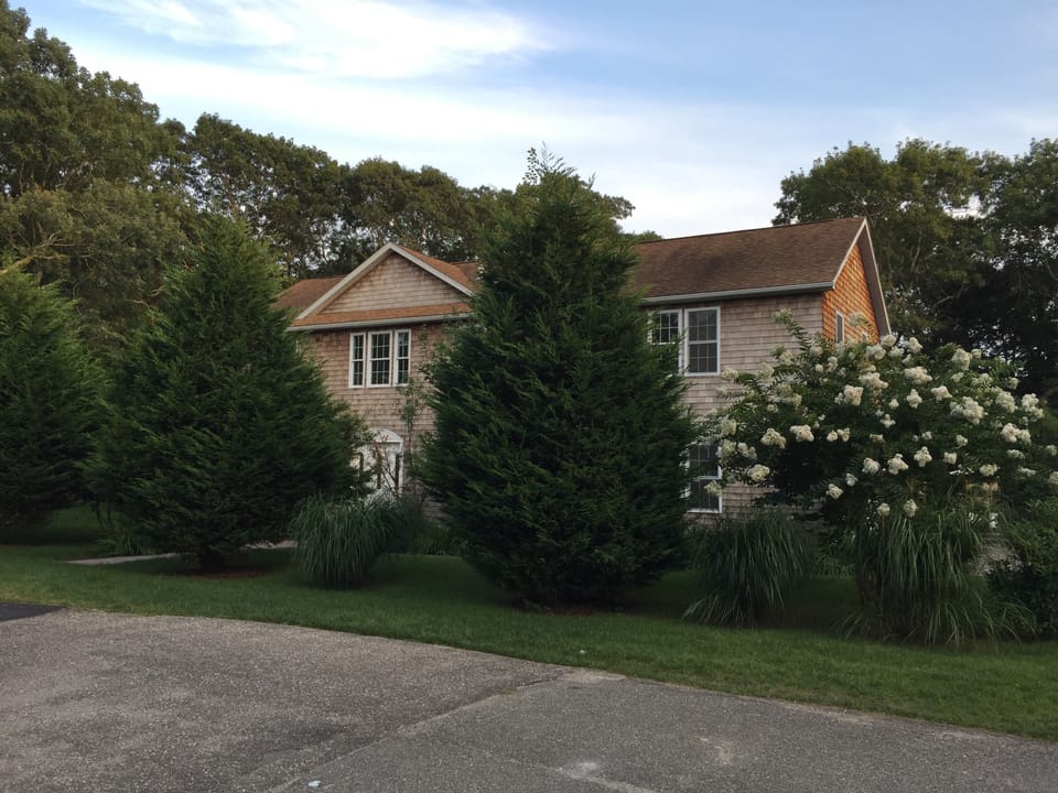 Classic cedar shake located on quiet cul-de-sac, very private 0.5 acre 