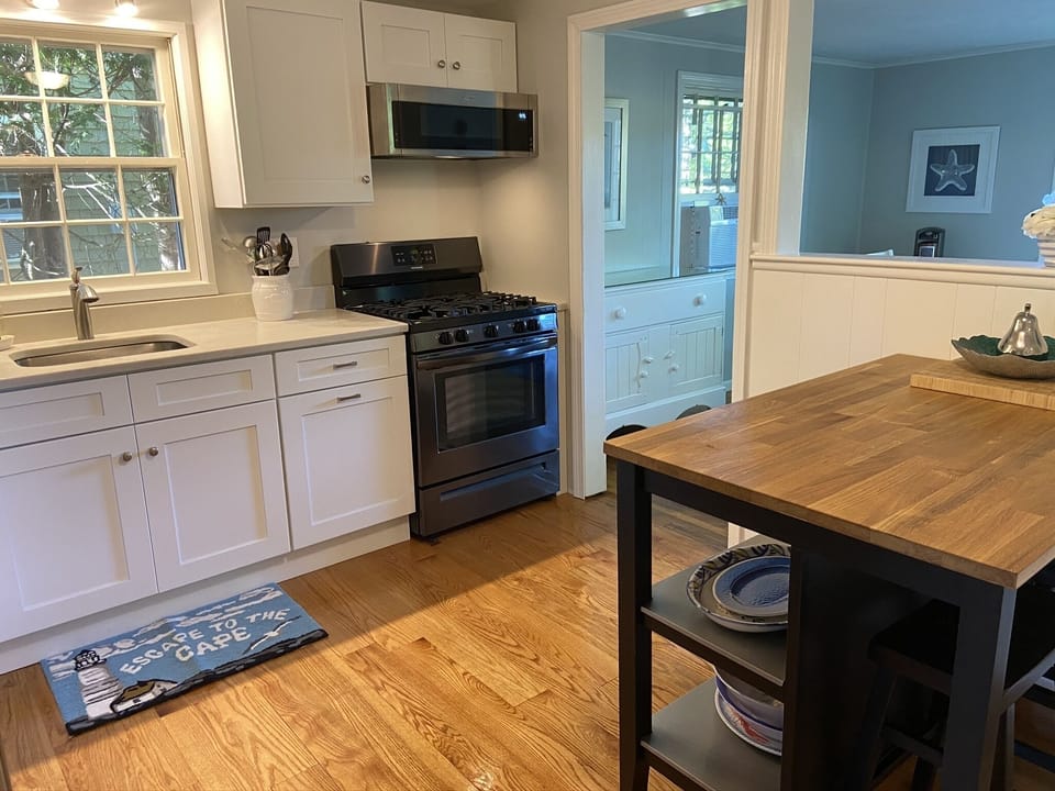 Enjoy large eat in kitchen with island, seating for 2.  Nicely stocked. 