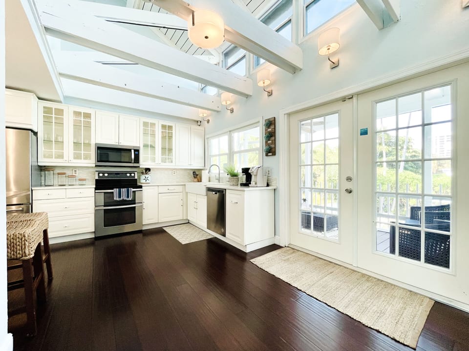 You will find our beautiful lanai overlooking the pool right outside the kitchen