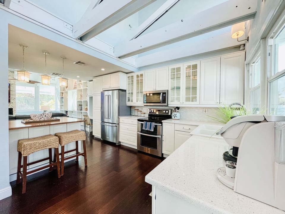 Fully equipped kitchen with pots, pans . utensils and much more.