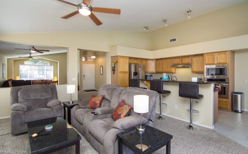 Family Room with Gas Fireplace.  Large Kitchen with Countertop Seating