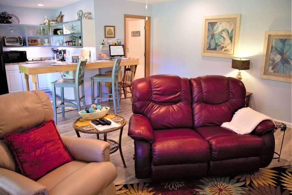 relax in front of the electric fireplace and 55in. high def flat screen