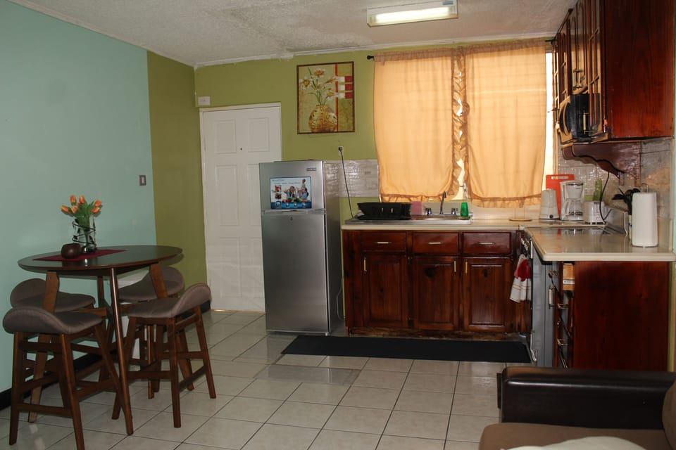 Fully-equipped kitchenette complete with microwave, coffee maker, toaster & more