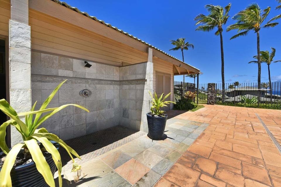 Well-maintained resort walkways winding through lush tropical landscaping and low-rise villa buildings.