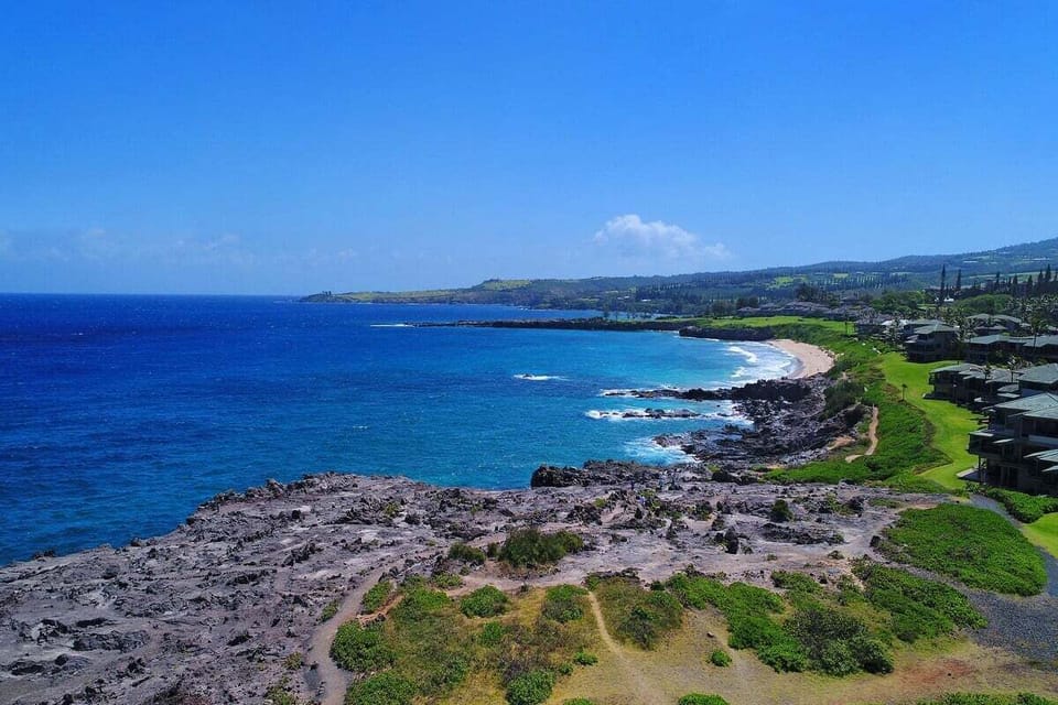 Scenic ocean view overlooking Kapalua's rugged coastline, lava rock shoreline, and deep blue Pacific waters.
