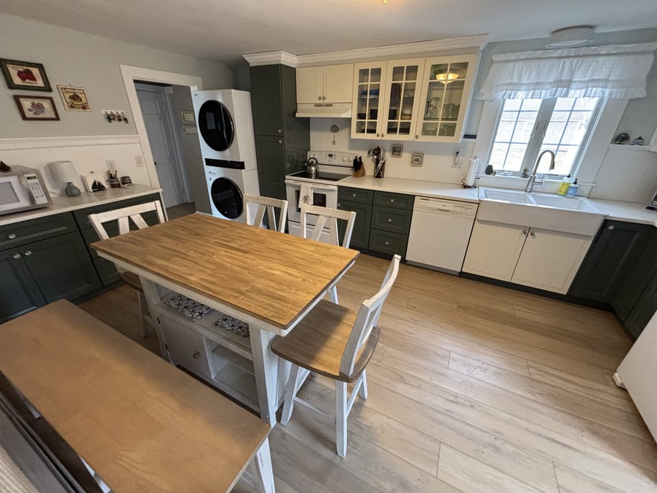 Kitchen has stackable washer/dryer!