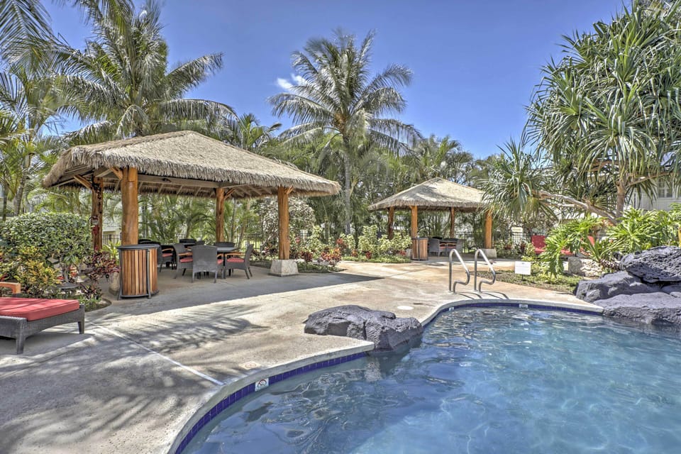 Tiki Huts at Pool - each has bbq grill, table and chairs