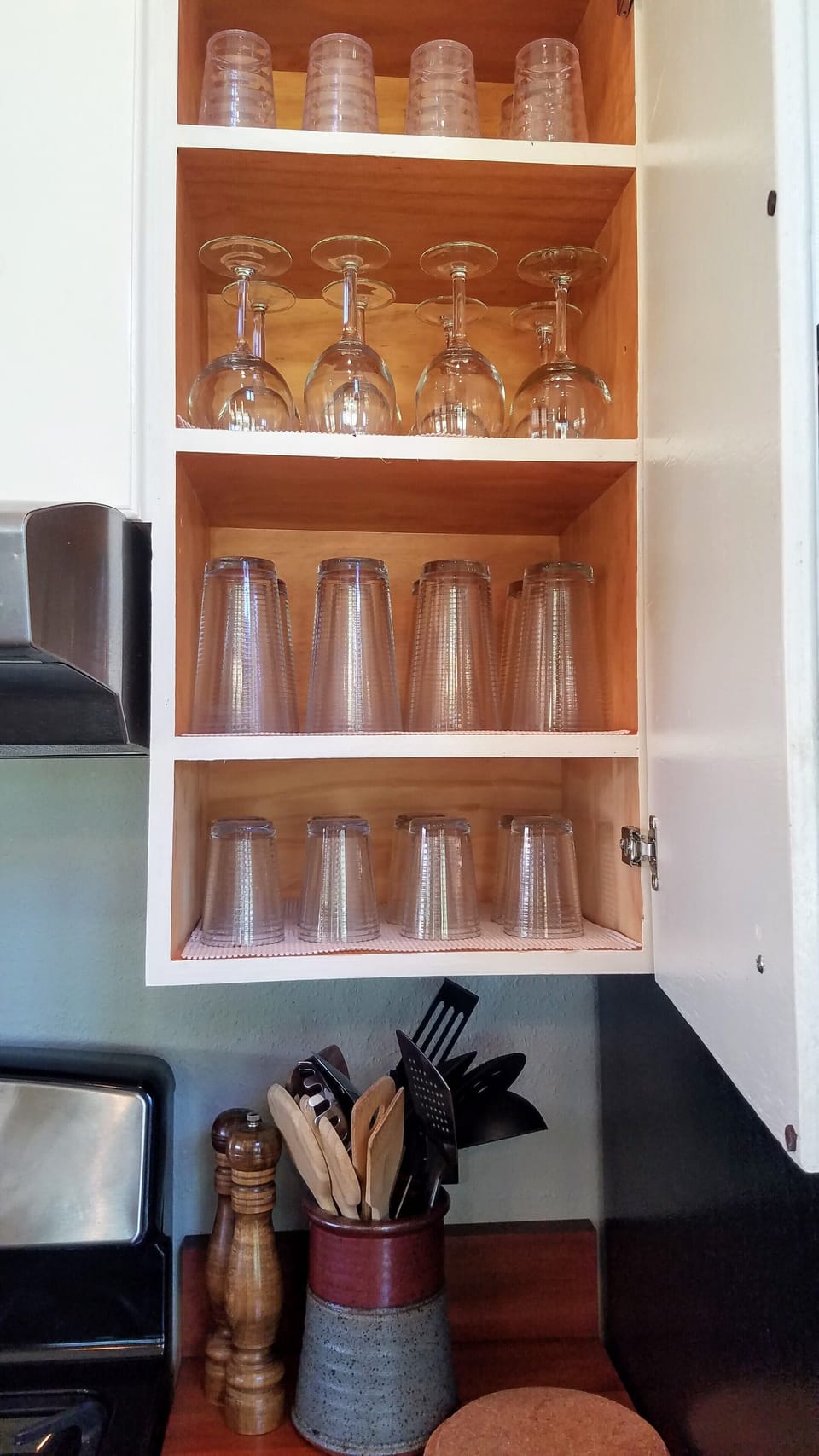 Kitchen is fully stocked with cookware and dishes