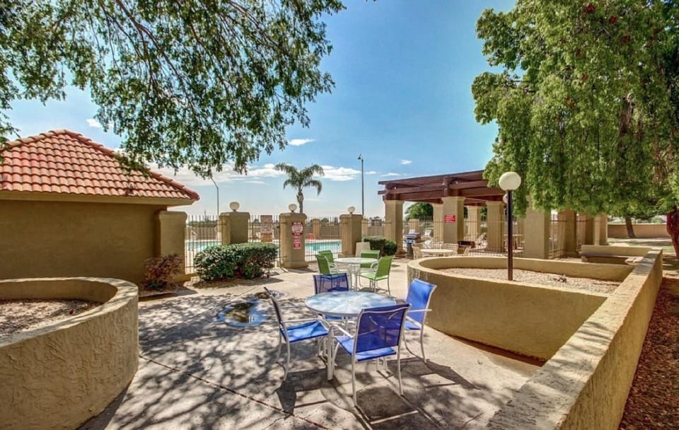 BBQ and common area; pool in background