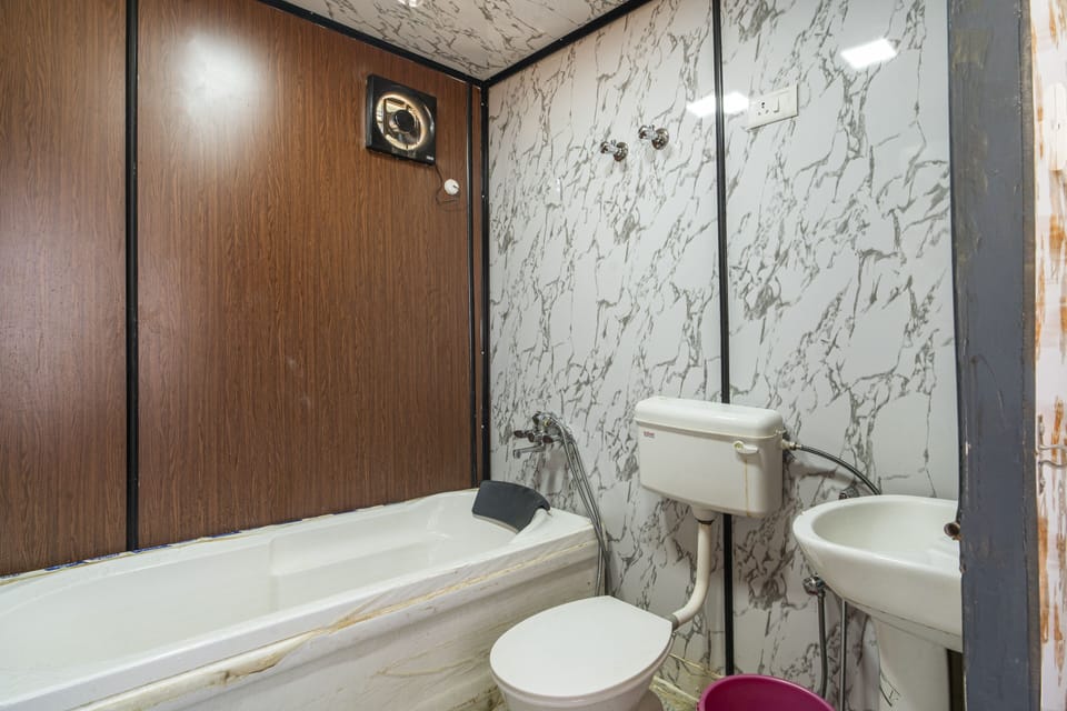 Luxury Desert Cottage | Bathroom | Shower, rainfall showerhead, toilet paper