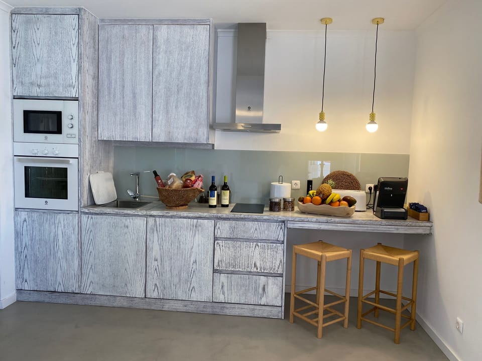 Deluxe Villa | Private kitchen | Full-size fridge, microwave, oven, stovetop