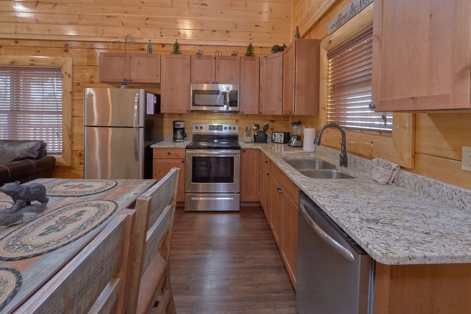 The kitchen is fully stocked with basic cooking utensils.