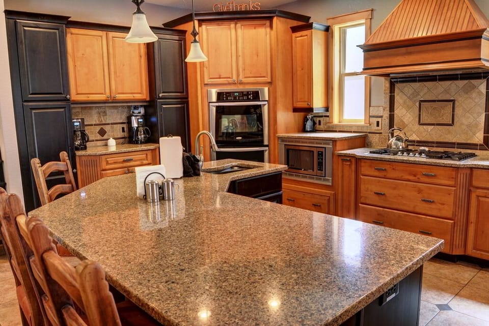 Large kitchen accommodates many workers -- coffee center and double ovens shown 