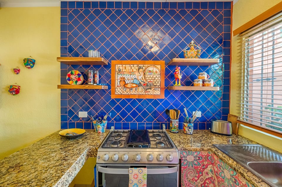 Stove, countertops and decorative backsplash
