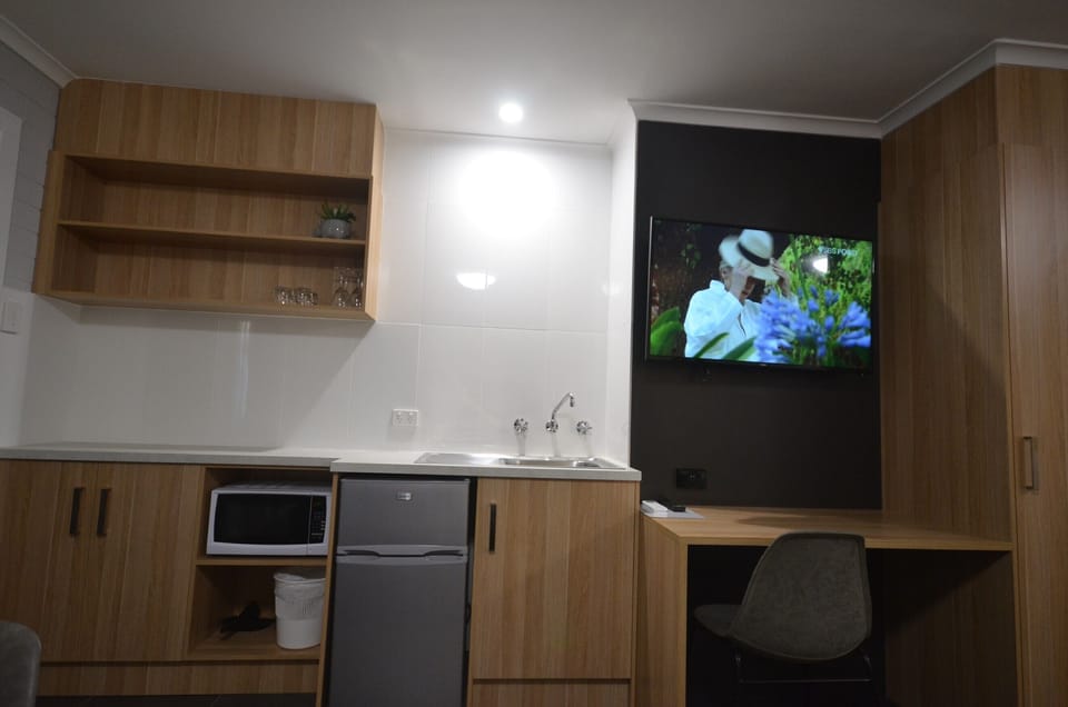 Family Room, Kitchenette | Television