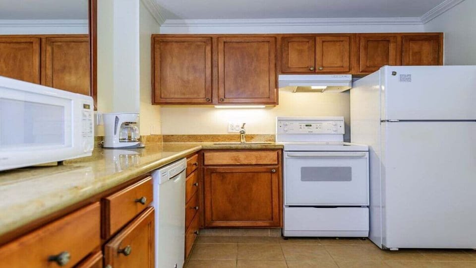 Modern kitchen with tropical flair—fully stocked for easy island living.