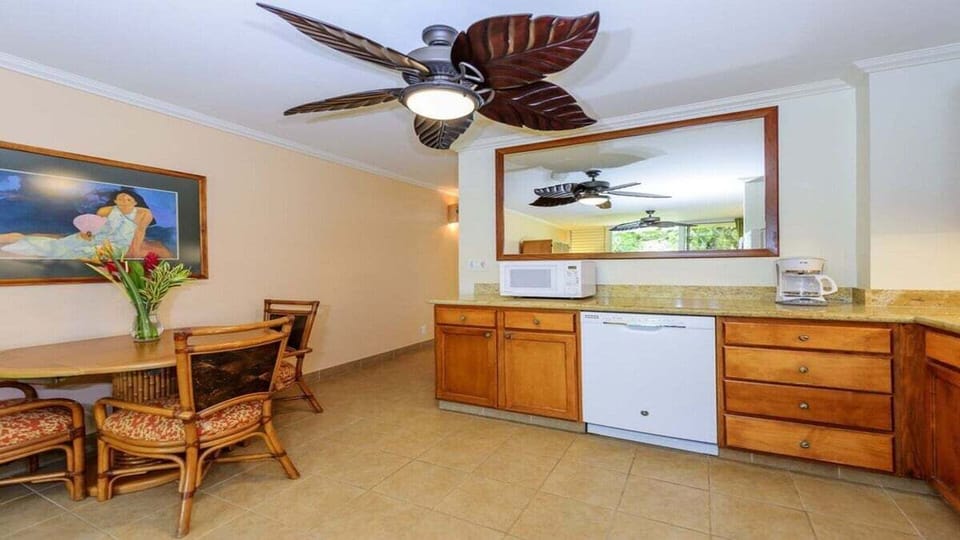 Kitchen with Leaf-Blade Ceiling Fan.
Warm wood tones and island charm—fully equipped for easy meals.