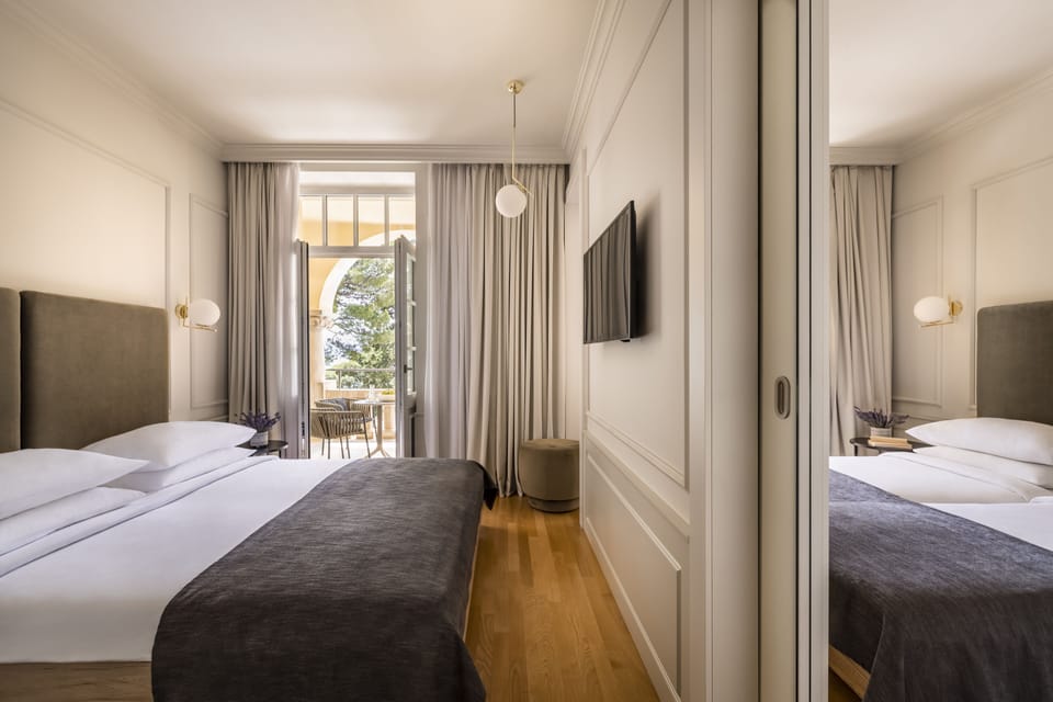 Superior family room with seaside balcony | Minibar, in-room safe, desk, laptop workspace