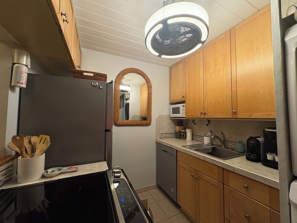 Kitchen- Full sized Whirlpool appliances, Nespresso & K-Cup Coffee, microwave.