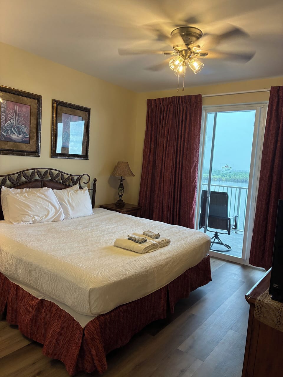 Master bedroom with king bed & sliding doors to balcony
