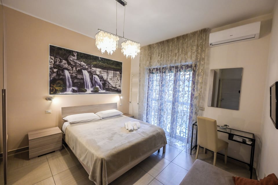 Deluxe Quadruple Room | Desk, blackout drapes, free WiFi, bed sheets