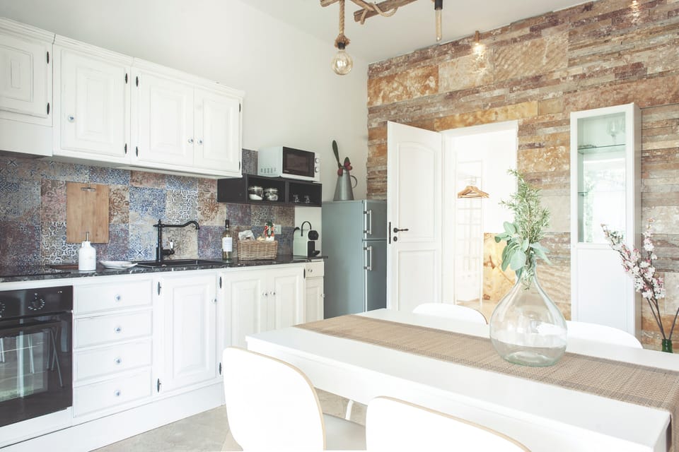 Apartment, Garden Area (Melograno) | Private kitchen | Full-size fridge, microwave, oven, stovetop