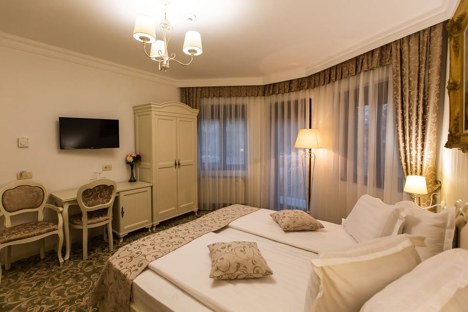 Deluxe Double Room, Balcony, City View (4*) | Premium bedding, minibar, in-room safe, individually decorated