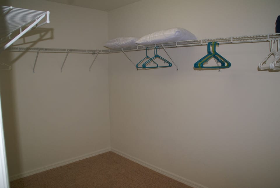 Huge walk-in closet in master bedroom