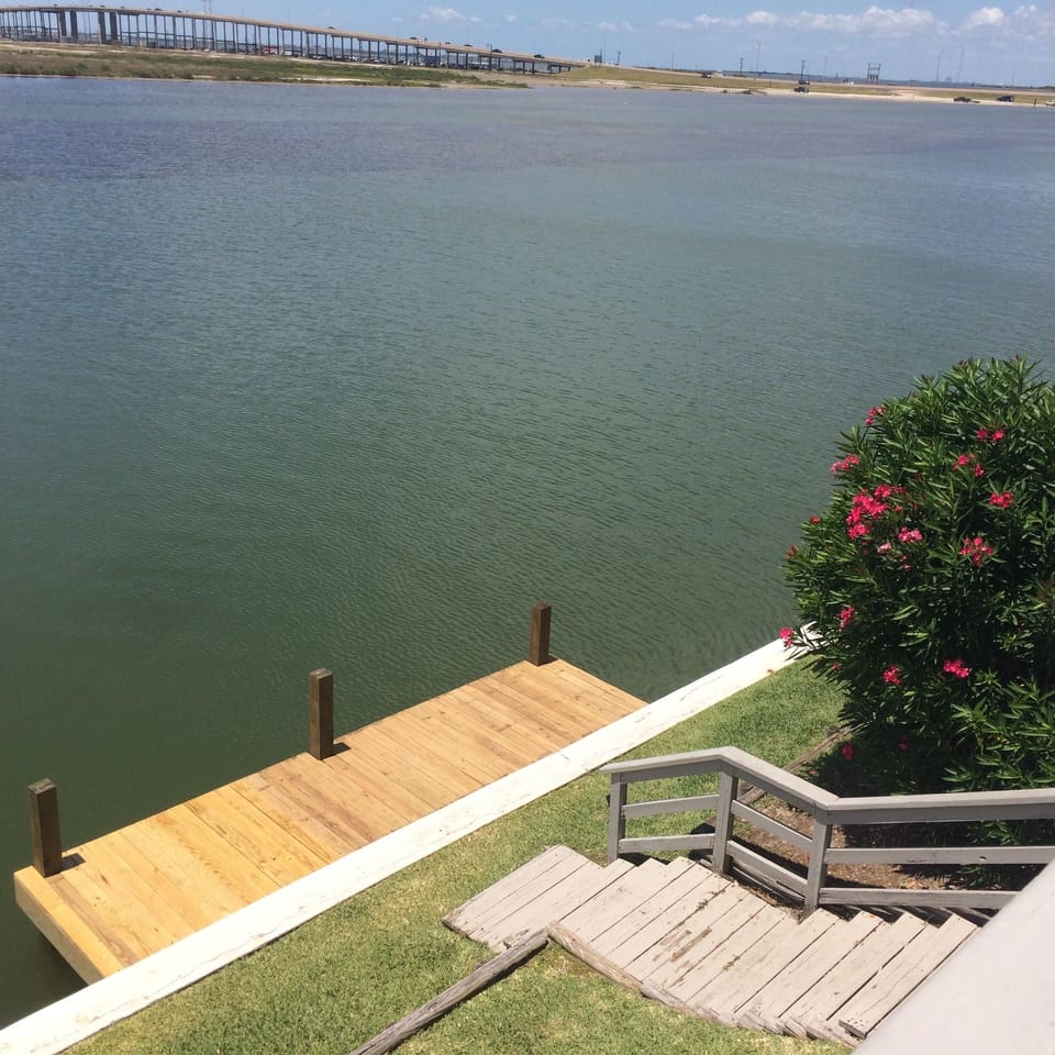 Boat/fishing dock at the bottom of our steps with  fish cleaning station.